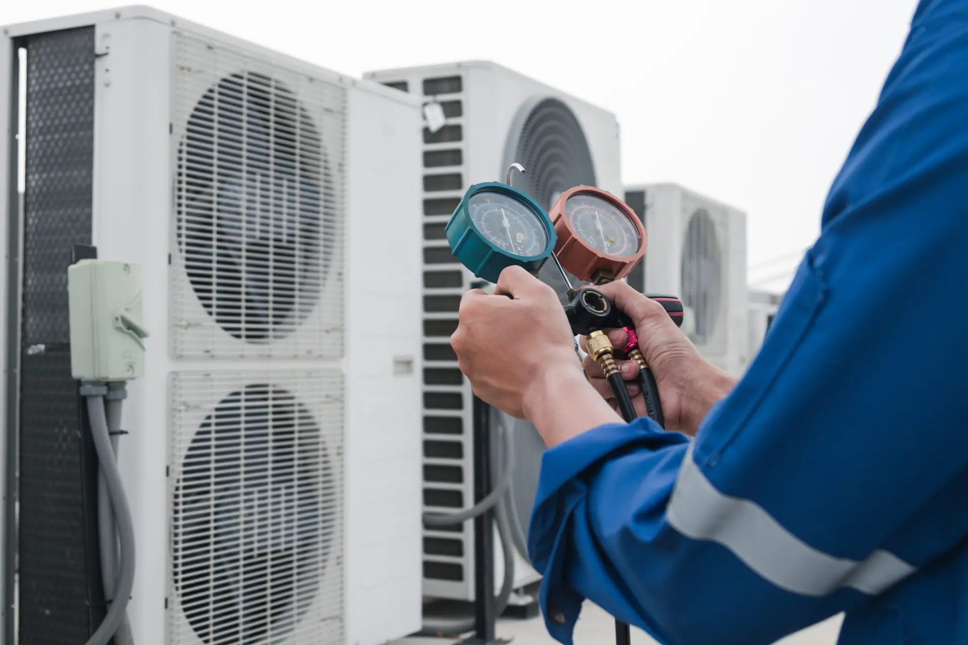 Technician is checking air conditioner,measuring equipment for filling air conditioners.